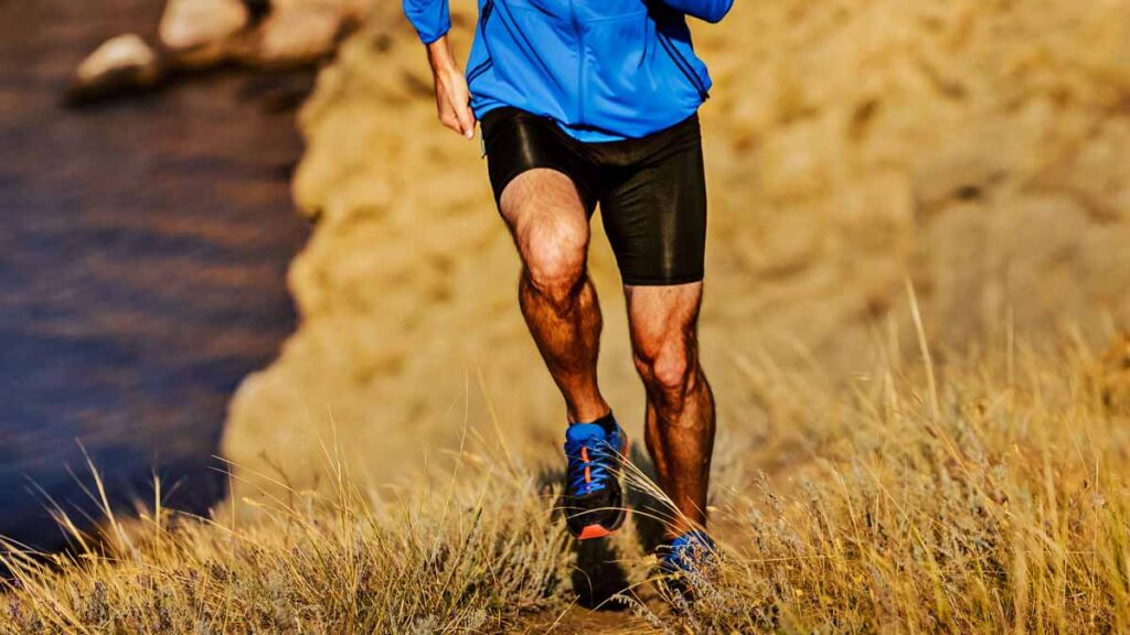muscular legs of runner man